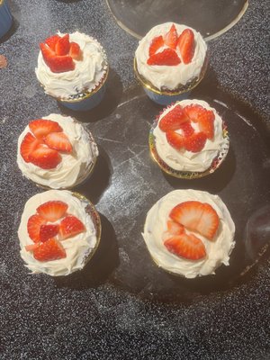 Edible brownie w/infused cream cheese frosting w/strawberries.