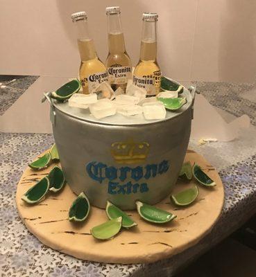 Corina bucket cake all edible 
 Even the ice cubes and the lemon wedges shots