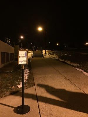 if you're pushing a wheelchair, look for the sign in the back of the theater to see which path to take