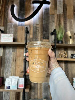 Regular Iced Latte (~$5): with Lavender Bitters ($0.75) and Oat Milk ($0.75)