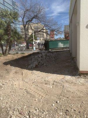 Demotion work done in downtown Austin breaking concrete with skid steer and mini excavator.