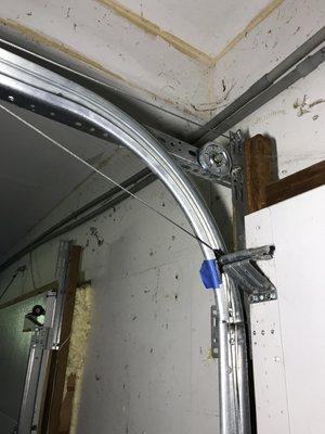 Garage door cable detached/off pulley