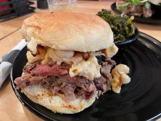 Mac Attack Sandwich with pulled pork and Mac-n-cheese with southern greens on the side.