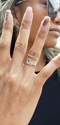 Nice rings, necklaces and accessories like this blingy "love" ring.