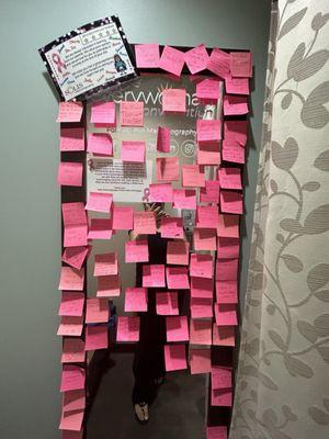 The mirror in the dressing room filled with positive post it notes.