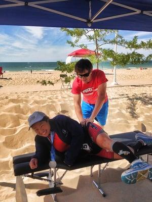 Treating athletes at the Steelhead Ironman with Active Release Techniques.