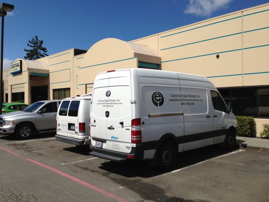 Service vans out front of office