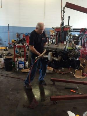 AL putting the final touches on the Corvette engine before it goes back in the car.