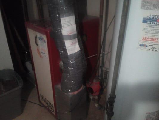 Here is our customers' old cast iron boiler and tank type water heater.  They won't be buying water heaters again with the ne...