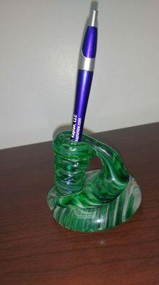 Blue Law Offices of Alexis B. Kaplan, LLC pen in green glass holder.