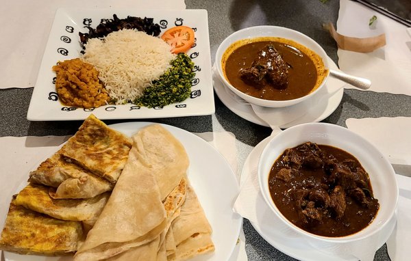 Rice, King Fish Gravy, Lamb Black Gravy, and Godamba Roti