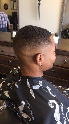 Mid fade w/ #2 guard and straight razón on sides