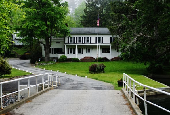 View coming onto the property of the main house. Office on the far left of main house. Door next to garage.