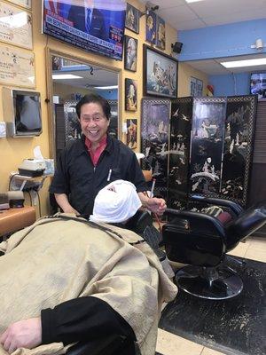 Hubby enjoying his hot towel shave!