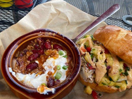 Elk chili and blackened cod sando on challah bun with pineapple salsa