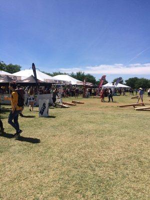 Corn hole on the way to the top shelf tent and VIP tent  in the back