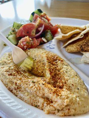 Homemade hummus with pita chips, Mediterranean salad