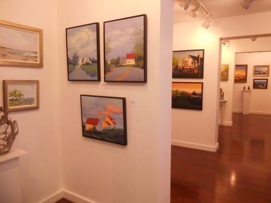 We have over 30 artists works of art in the gallery at all times.  Seen here is Diana Johnson and behind that Neil Wyrick.