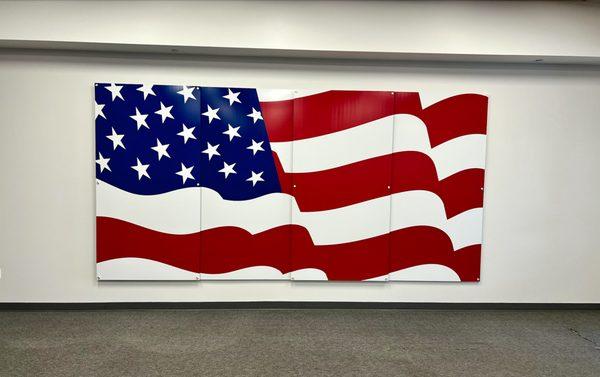 16'x8'ft American Flag sign. Constructed of (4) panels and printed on metal with white ink and mounted with stand-offs.