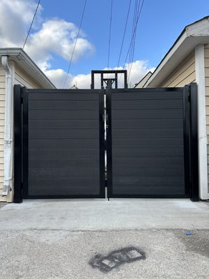 6' high custom horizontal composite with metal posts/ metal frame gates.