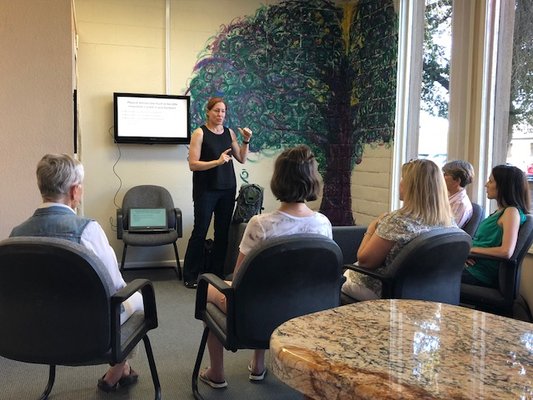 The doctors host health classes monthly. Here Dr. Nicole teaches about posture.