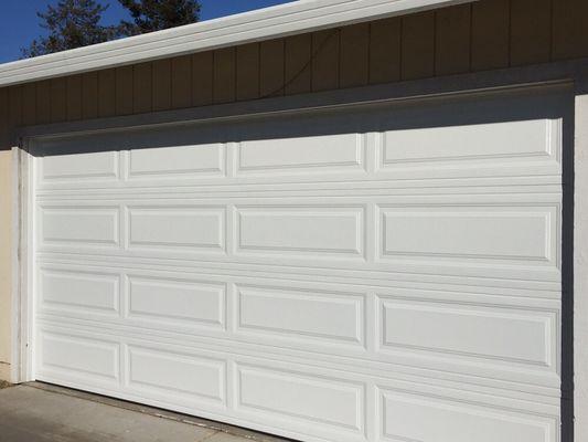 Regular garage door replacement non-insulated metal sectional $895.