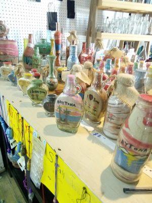 Original one of a kind sand art in bottles. Many different sizes, shapes and images