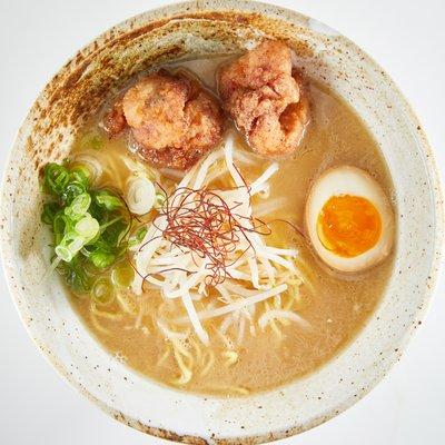 Paitan Savory, rich chicken broth served with kara-age fried chicken, marinated soft-boiled egg, green onions, garlic, bean sprouts