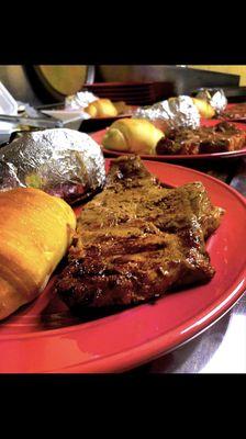 Delicious steak dinner with baked potato and homemade rolls!