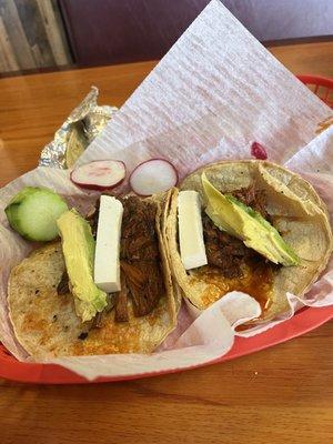 Barbacoa tacos (added guac and queso fresco)