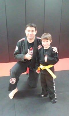 Nat getting hin Jiu Jitsu Yellow Belt.