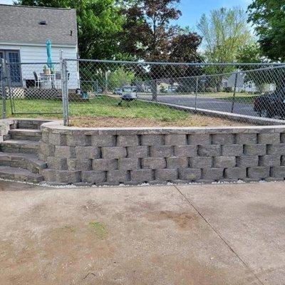 Retaining wall with chain link fence