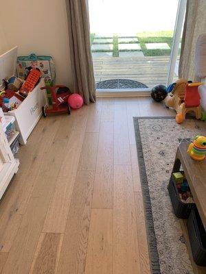 These are the new, wide plank engineered oak floors they installed.