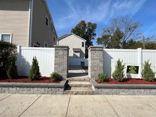 Brussels Unilock pillars , limestone steps - custom vinyl fence