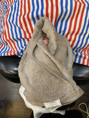 Steam towel after a facial massage