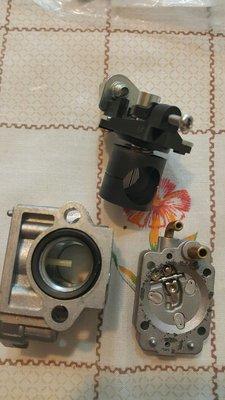 The old Carburetor in pieces