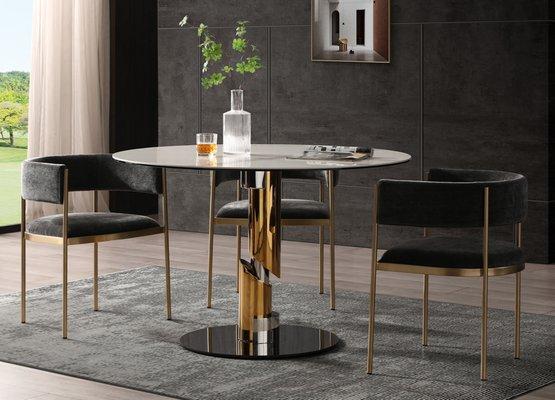 A very cool round dining table with ceramic top and steel base. Affordable price too. In stock USA.