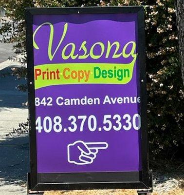 Large format sign in front of Vasona print copy design. Made by Vasona.