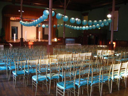 Silver Chiavari Chair rentals with blue cushions for a wedding.