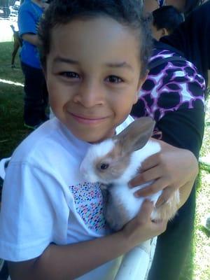 Enjoying one of the bunnies from a field trip event.