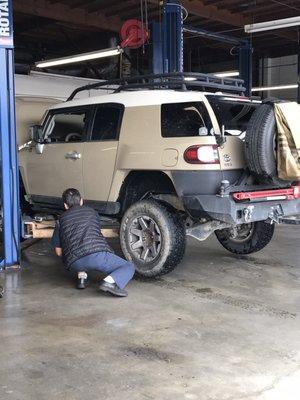 Brian finishing up the service on a vehicle.