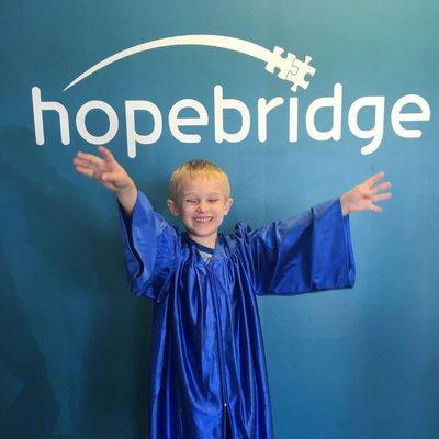 A Hopebridge kiddo graduating from his therapy.