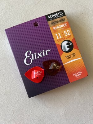 Elixir Phosphor Bronze 11|52 acoustic guitar strings and Herco guitar picks.