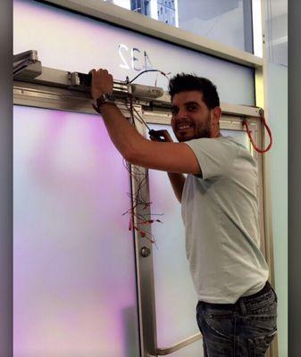 Johnny installing a mag lock to increase security for their business.