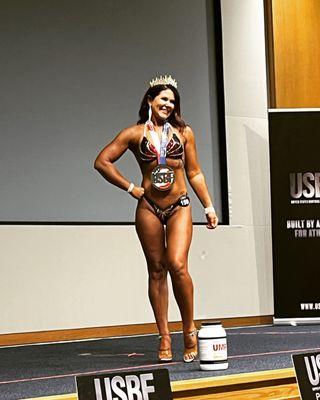 Tfit competitor and posing client Heather winning 1st place in figure.