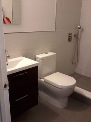 12x24 porcliean tiles, vanity, toilet, shower