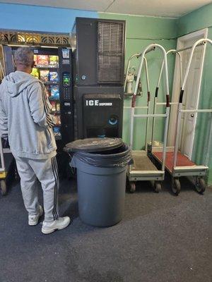 The area by the elevator with old luggage carts.