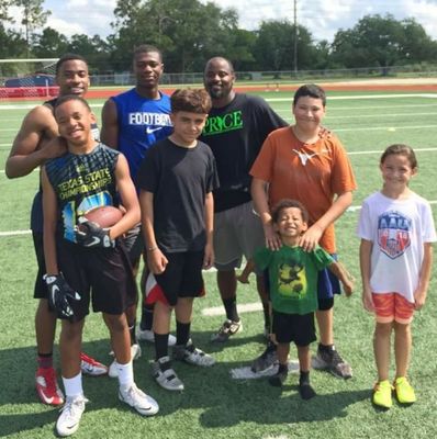 Track and football kids getting work in on the turf.