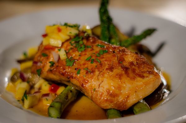 Caribbean Salmon  Pan Seared Salmon,  Asparagus, Rosemary Roasted Fingerling Potatoes, Mango Salsa. Honey Chipotle Sauce.