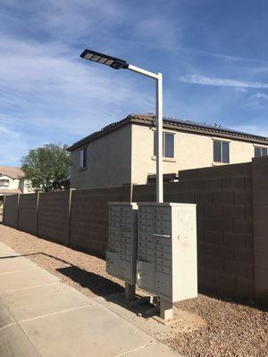 Replacing the non working lighting with our solar mail box lights.